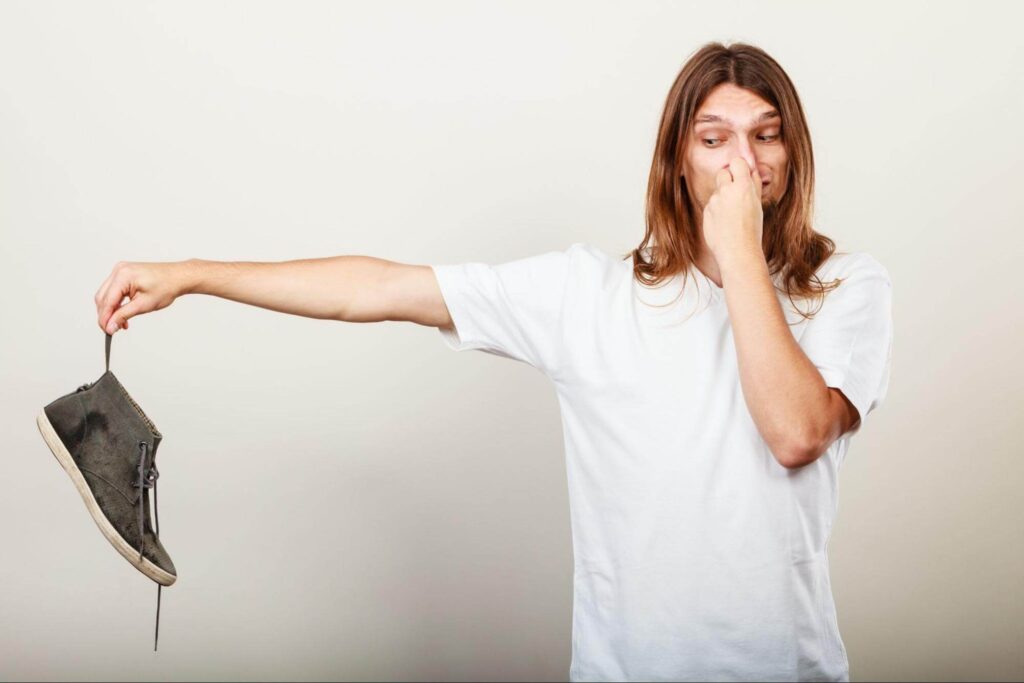 woman wondering how to prevent feet from sweating