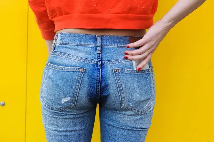 woman in jeans sweating how to stop bum sweat on chairs